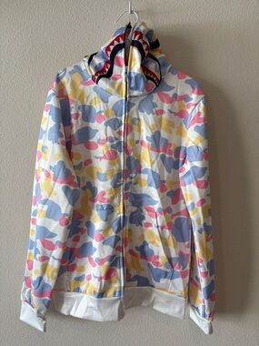 White hoodie with multi color pastel camo design